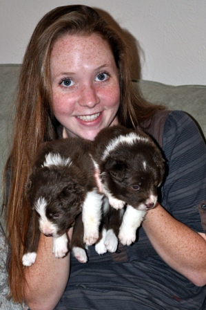 Claire holls both chocolate pups